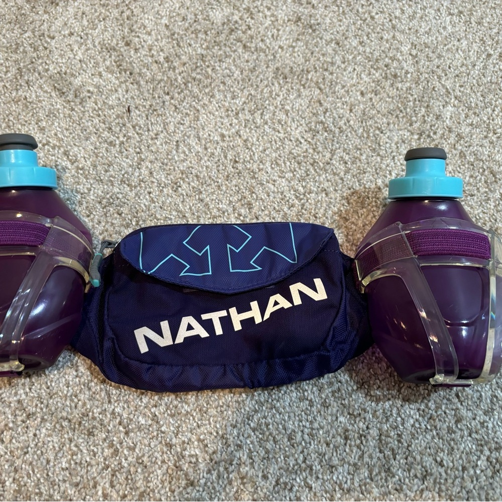 Nathan brand running belt with bottles.